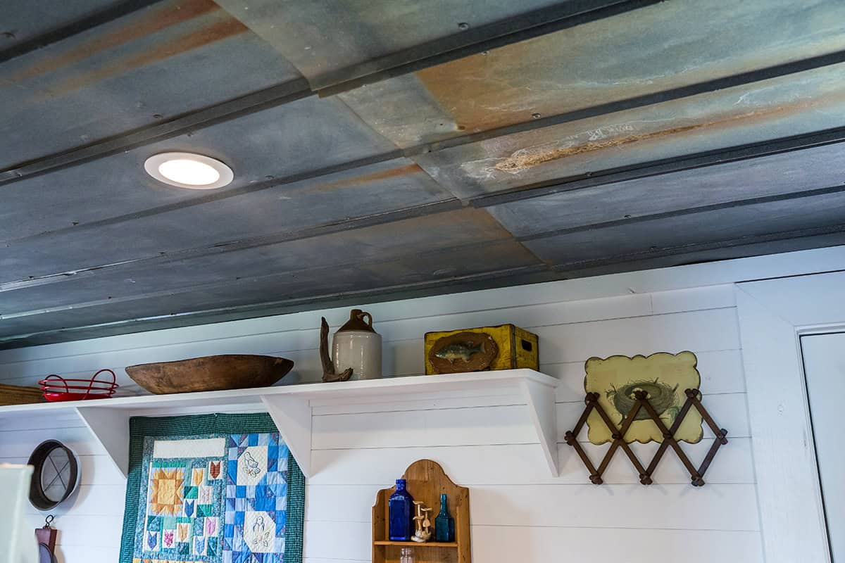 Farmhouse White Shiplap Walls With A Metal Ceiling