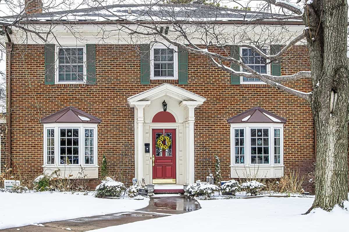 Light Gray Shutters on Brick House