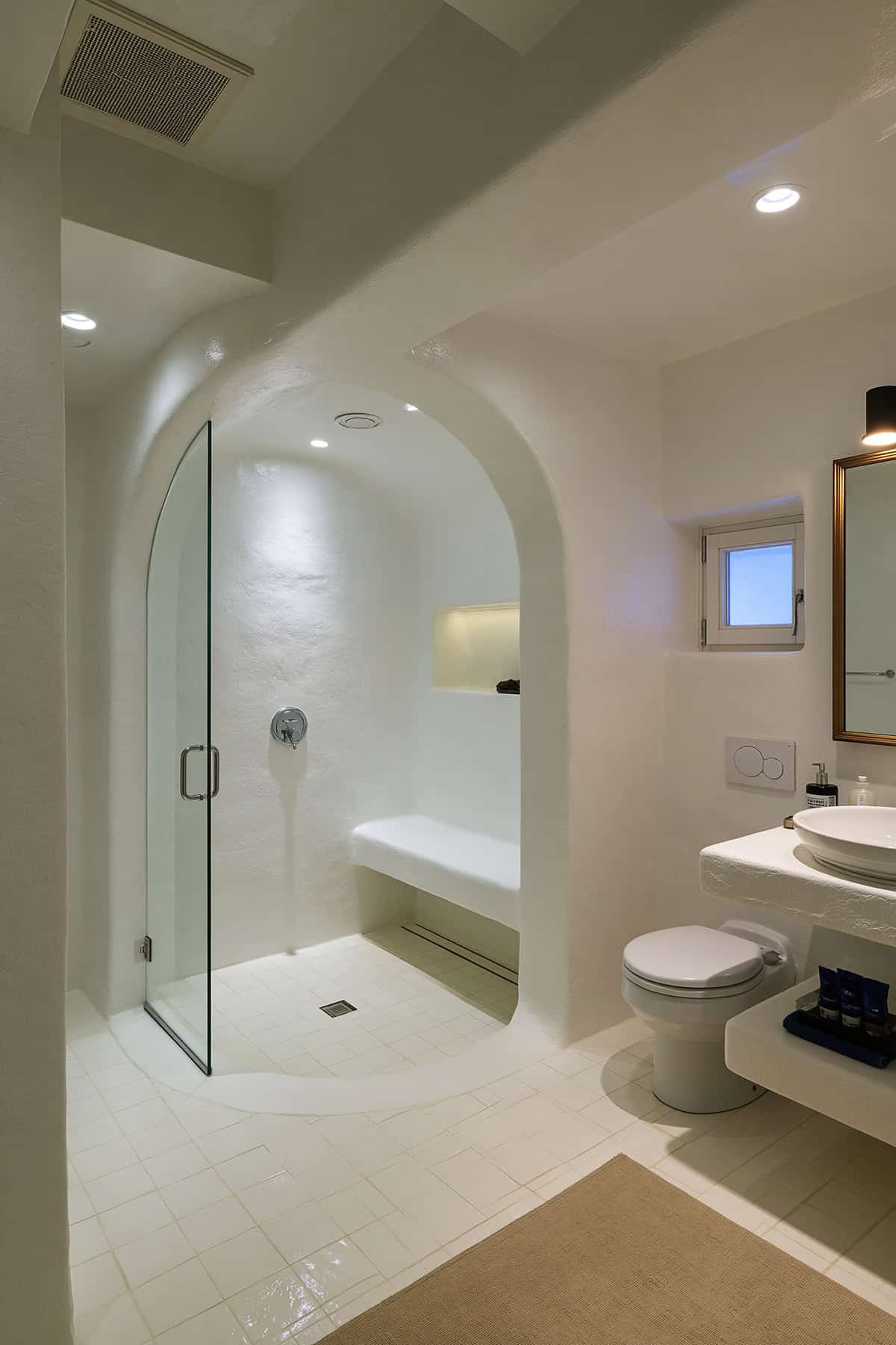 White Bathroom With Curved Shower Wall
