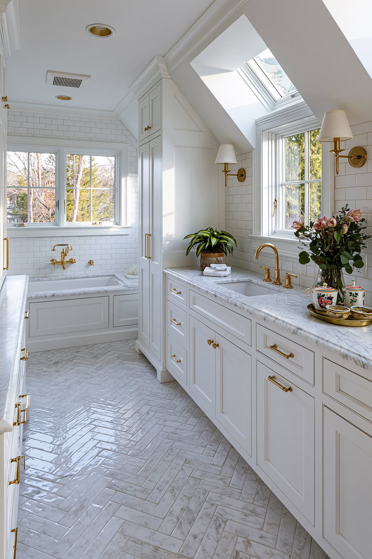 White Bathroom With Herringbone Floor Tile