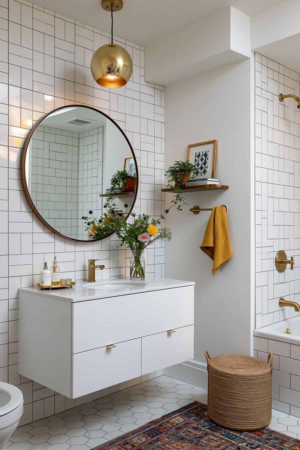 White Bathroom With Large Round Mirror