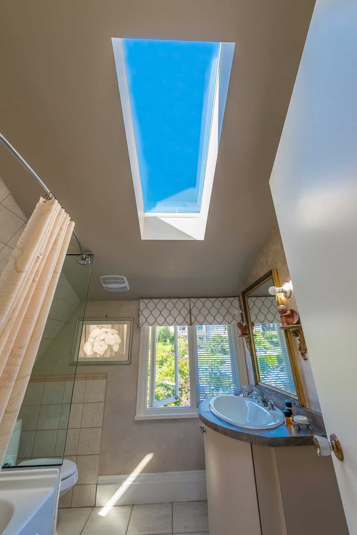 White Bathroom with Skylight Window