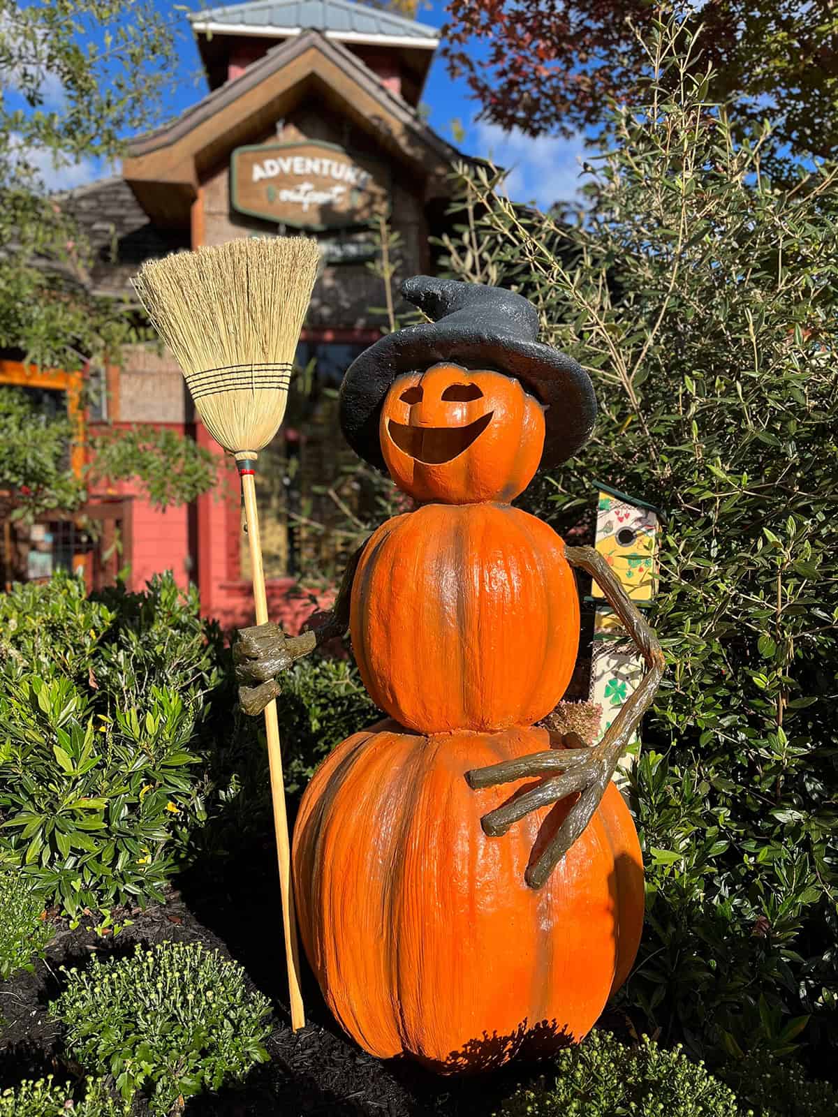 A Pumpkin Witch with a Straw Broom