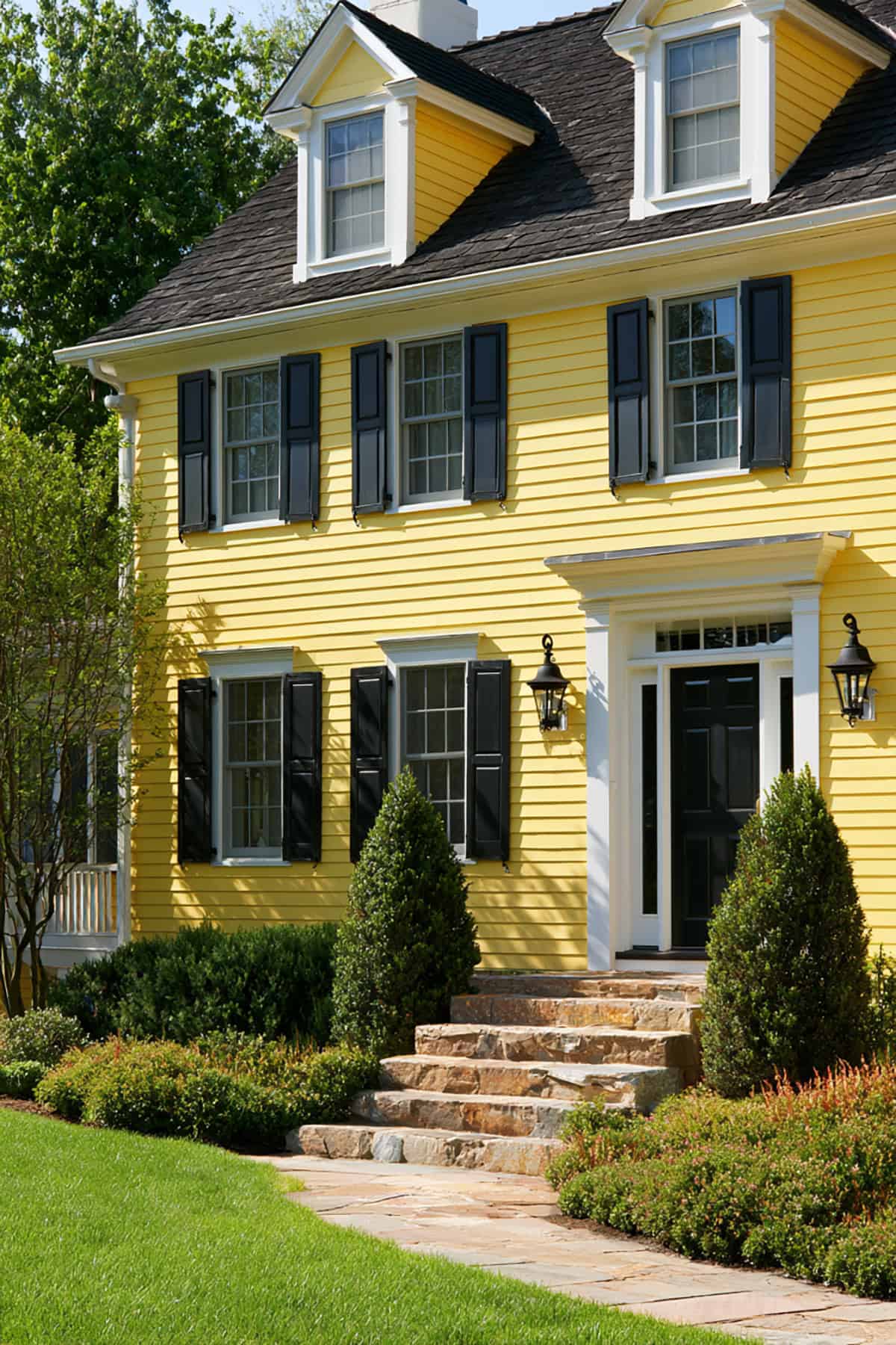 Charcoal Gray Shutters On A Yellow House