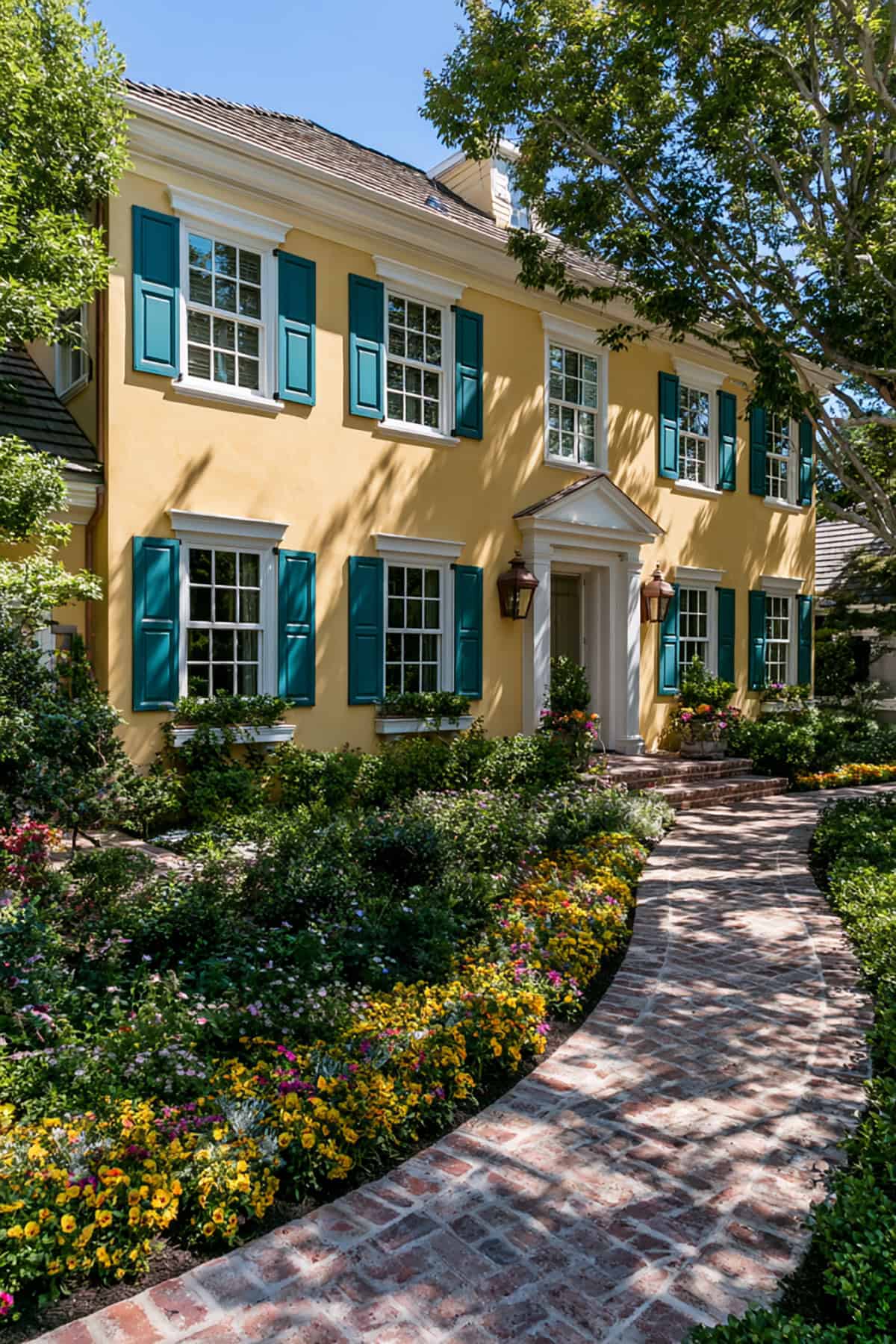 Deep Teal Shutters On A Yellow Exterior