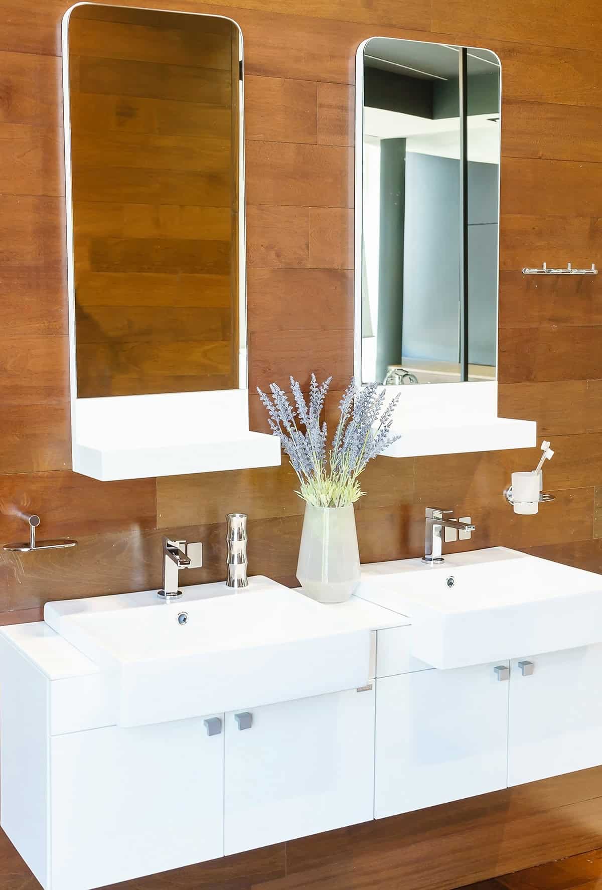 Floating White Vanity With Tall Rounded Mirrors