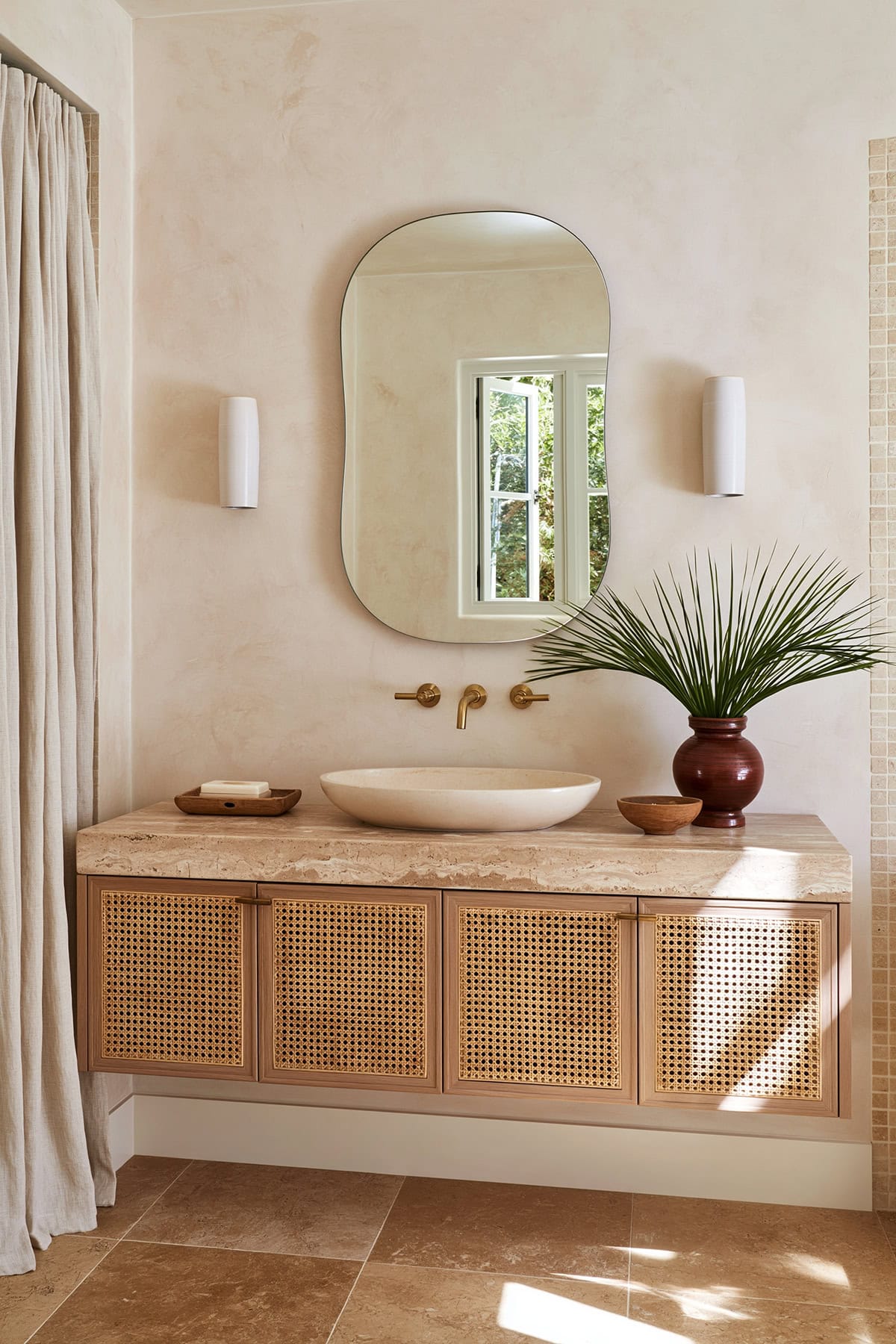 Limewashed Bathroom With A Woven Vanity Front