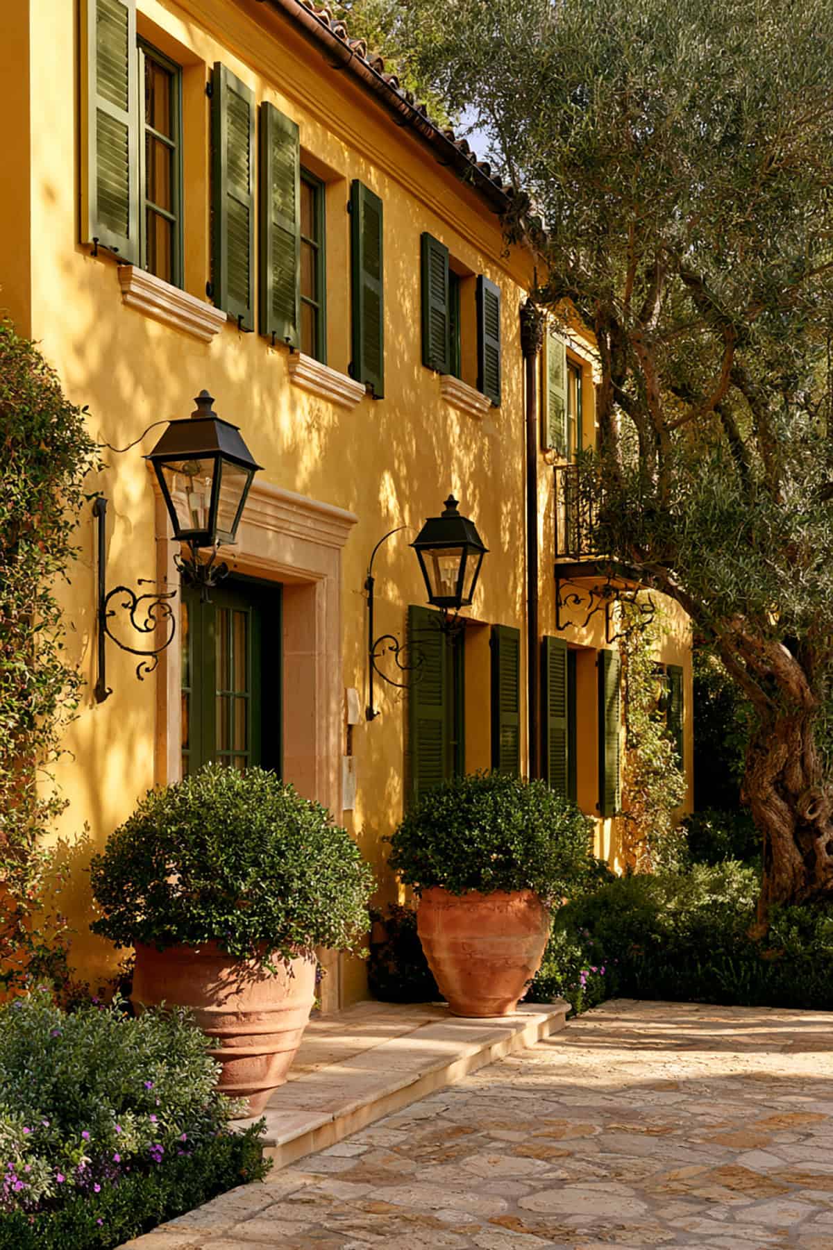 Olive Green Shutters On A Yellow House
