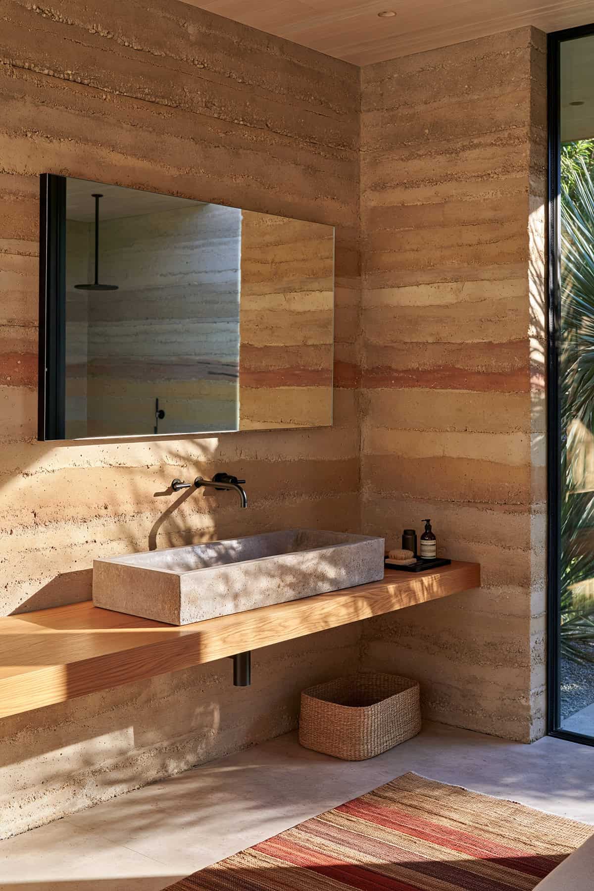 Rammed Earth Bathroom With A Concrete Basin