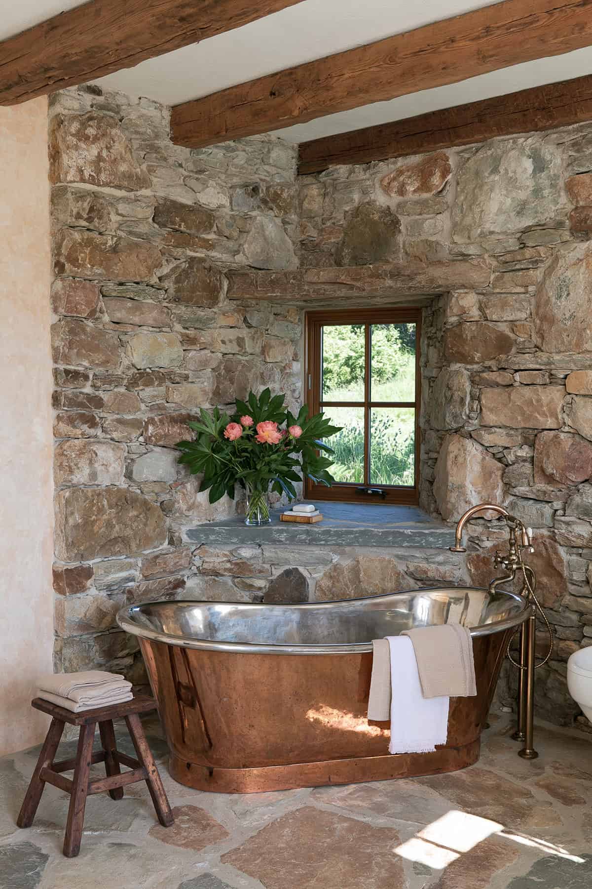 Rustic Stone Bathroom With A Copper Tub
