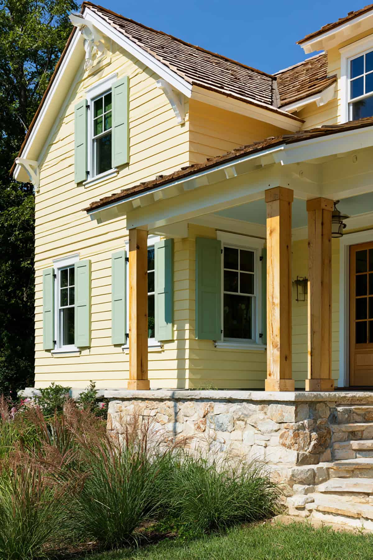 Sage Green Shutters On A Soft Yellow Farmhouse