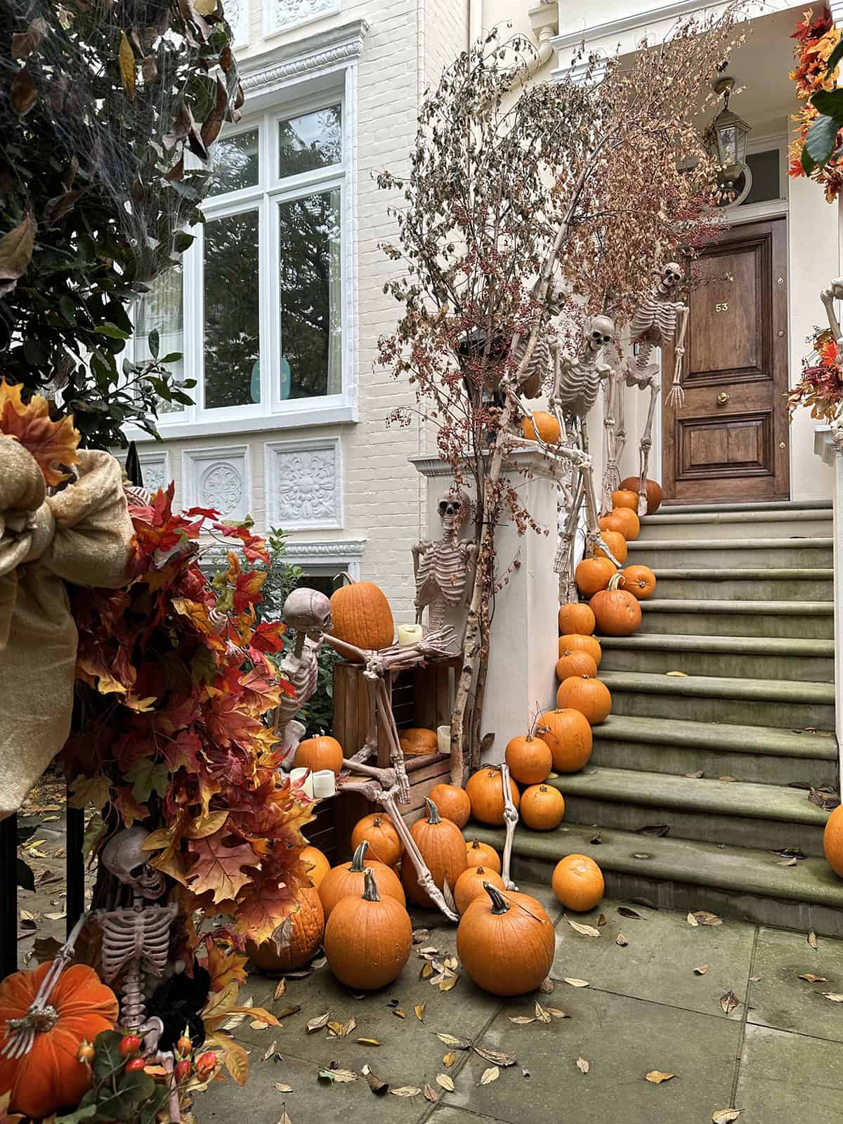 Skeletons Climb the Pumpkin Lined Steps