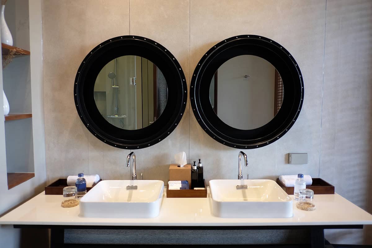 Twin Vessel Sinks And Oversized Round Mirrors