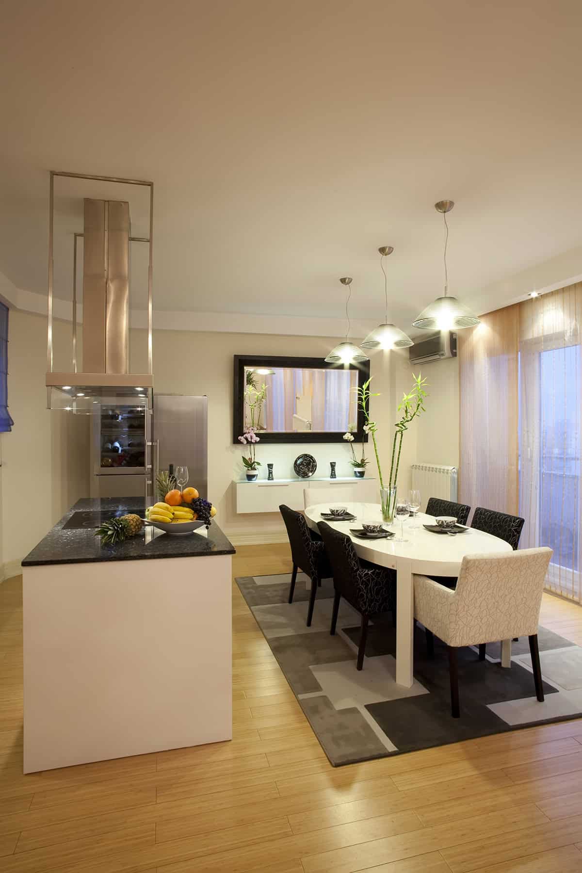Black Framed Mirror Above a Floating Buffet