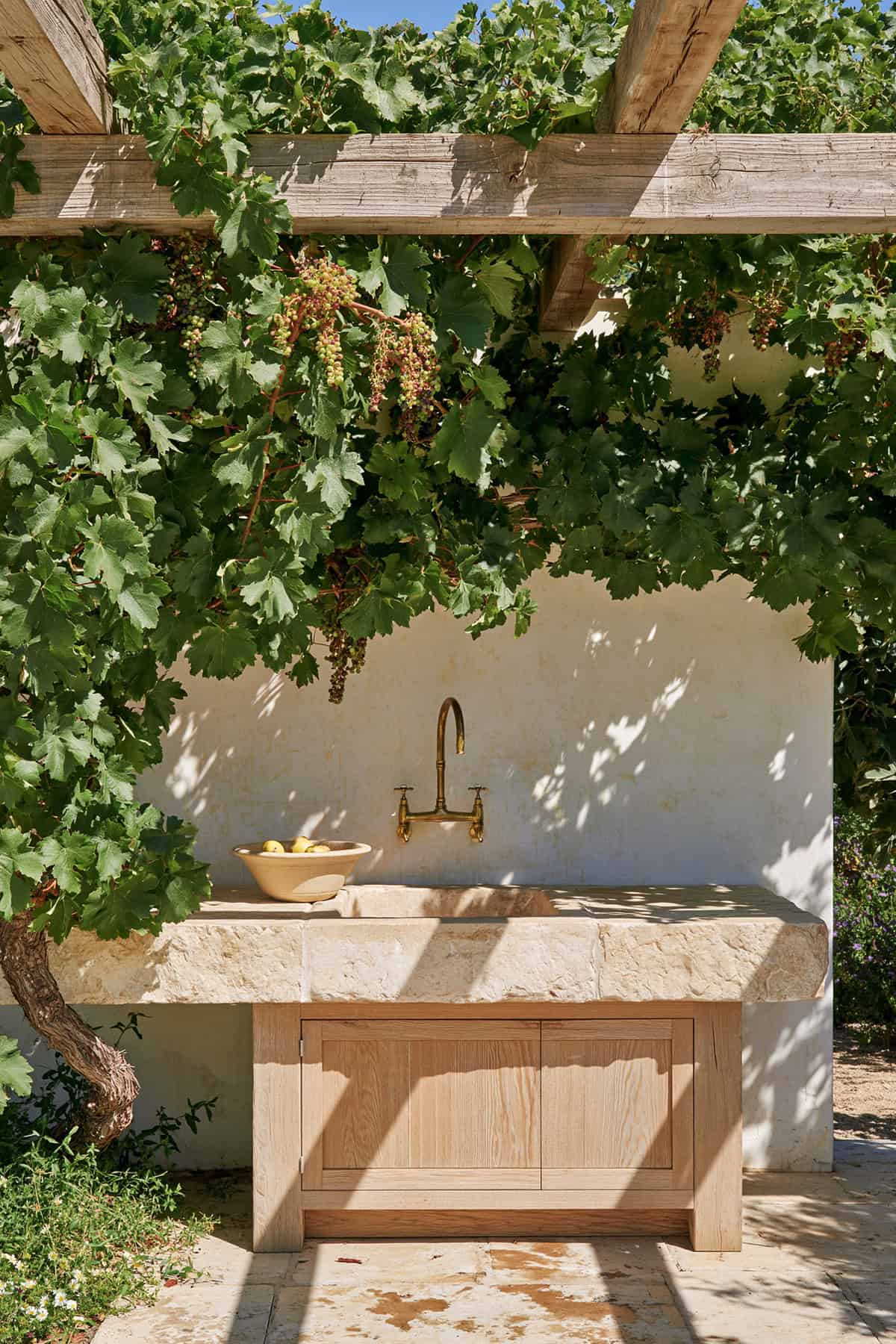 Limestone Farmhouse Sink Under A Pergola