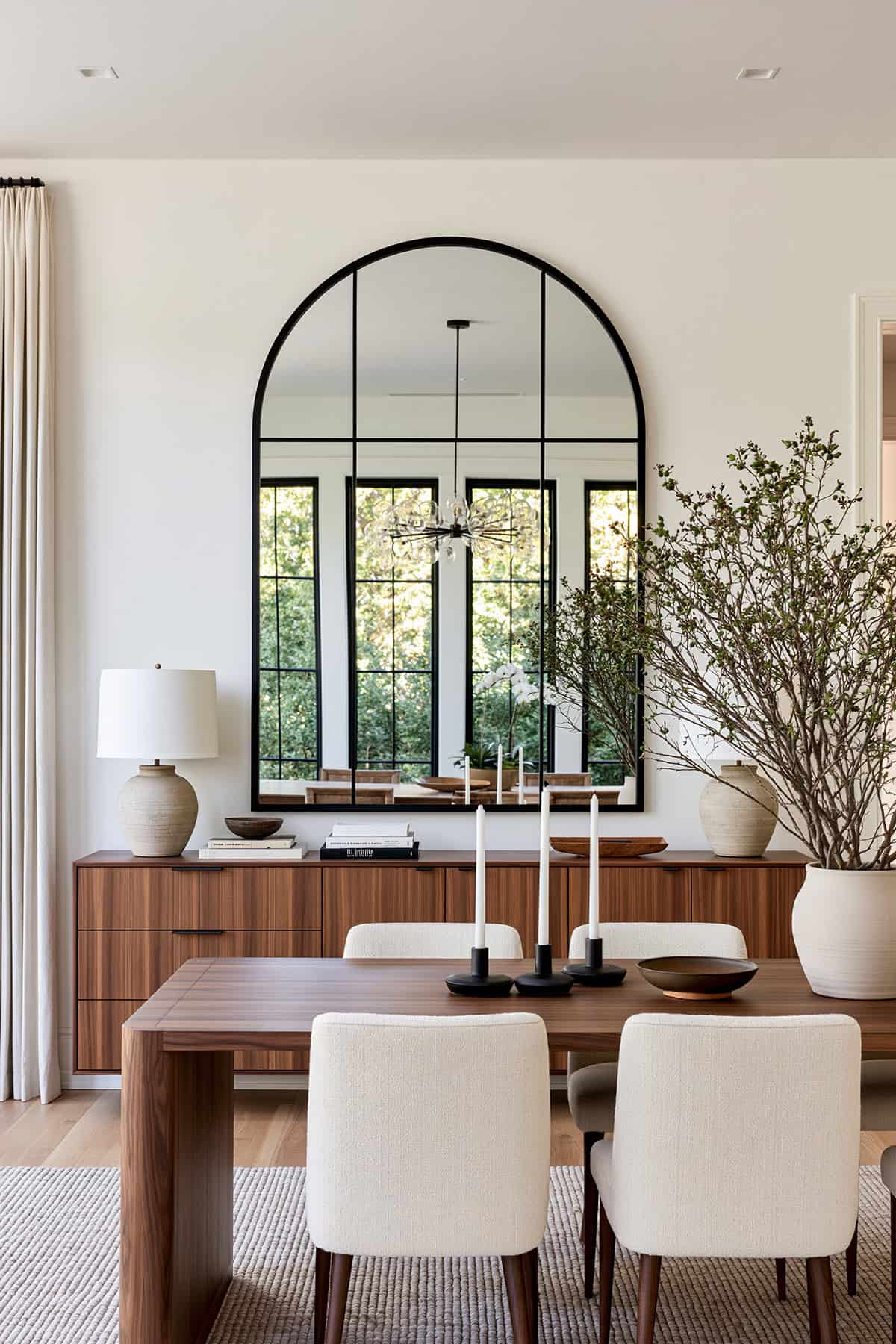 Oversized Arched Mirror Above a Sideboard