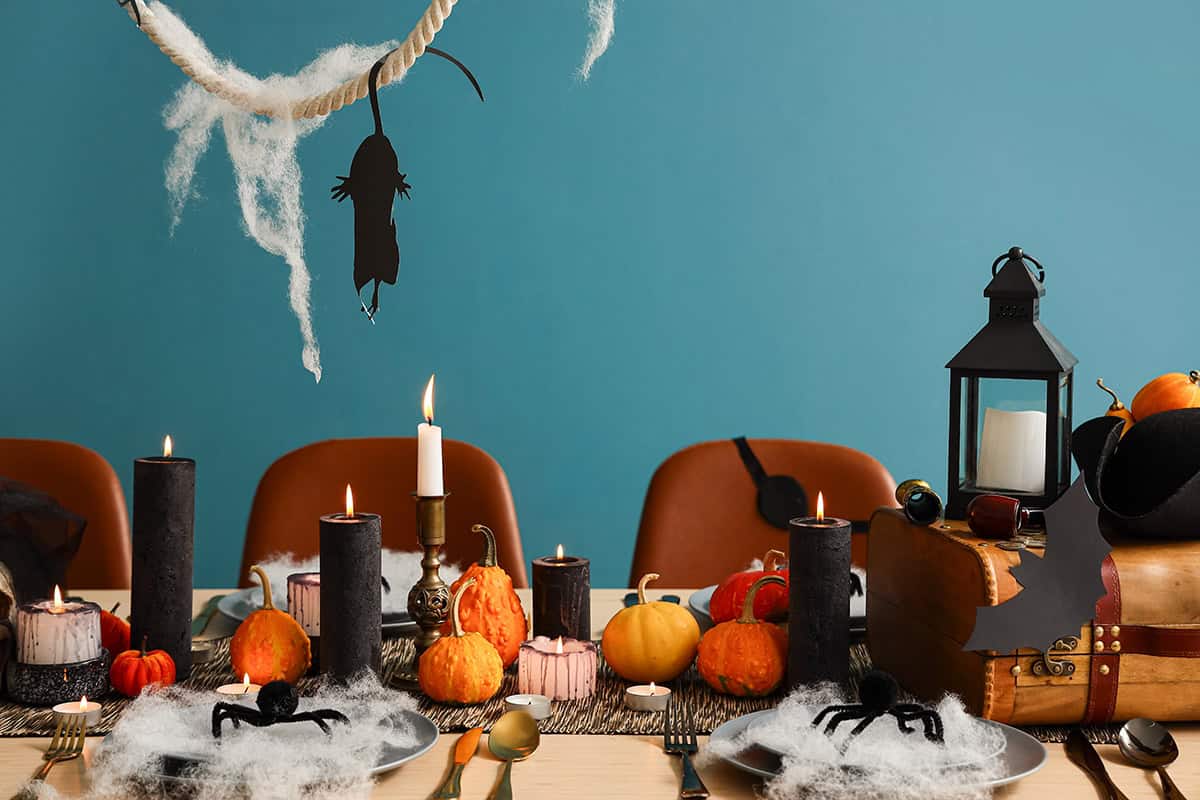 Pumpkins, Black Candles And Cobwebs For The Table