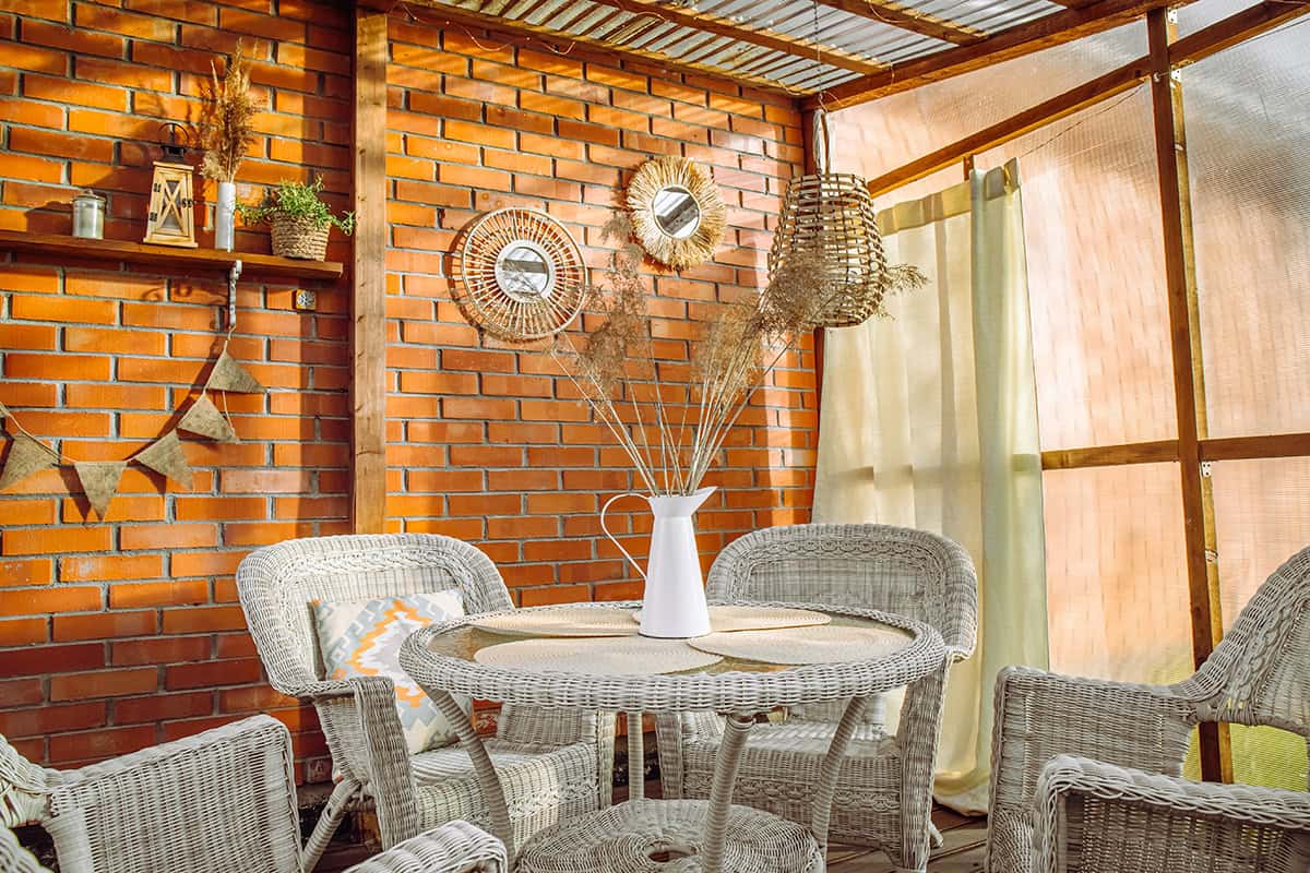 Rattan Mirrors on a Warm Brick Wall