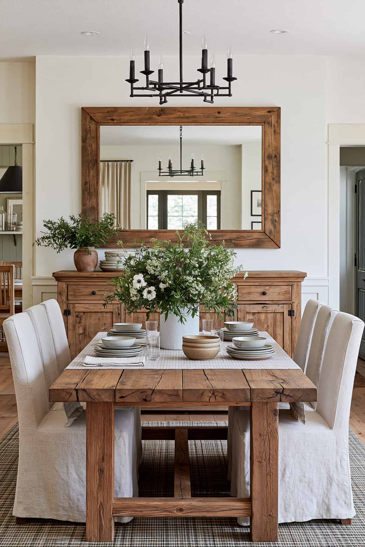 Rustic Wood Framed Mirror Above a Farmhouse Hutch