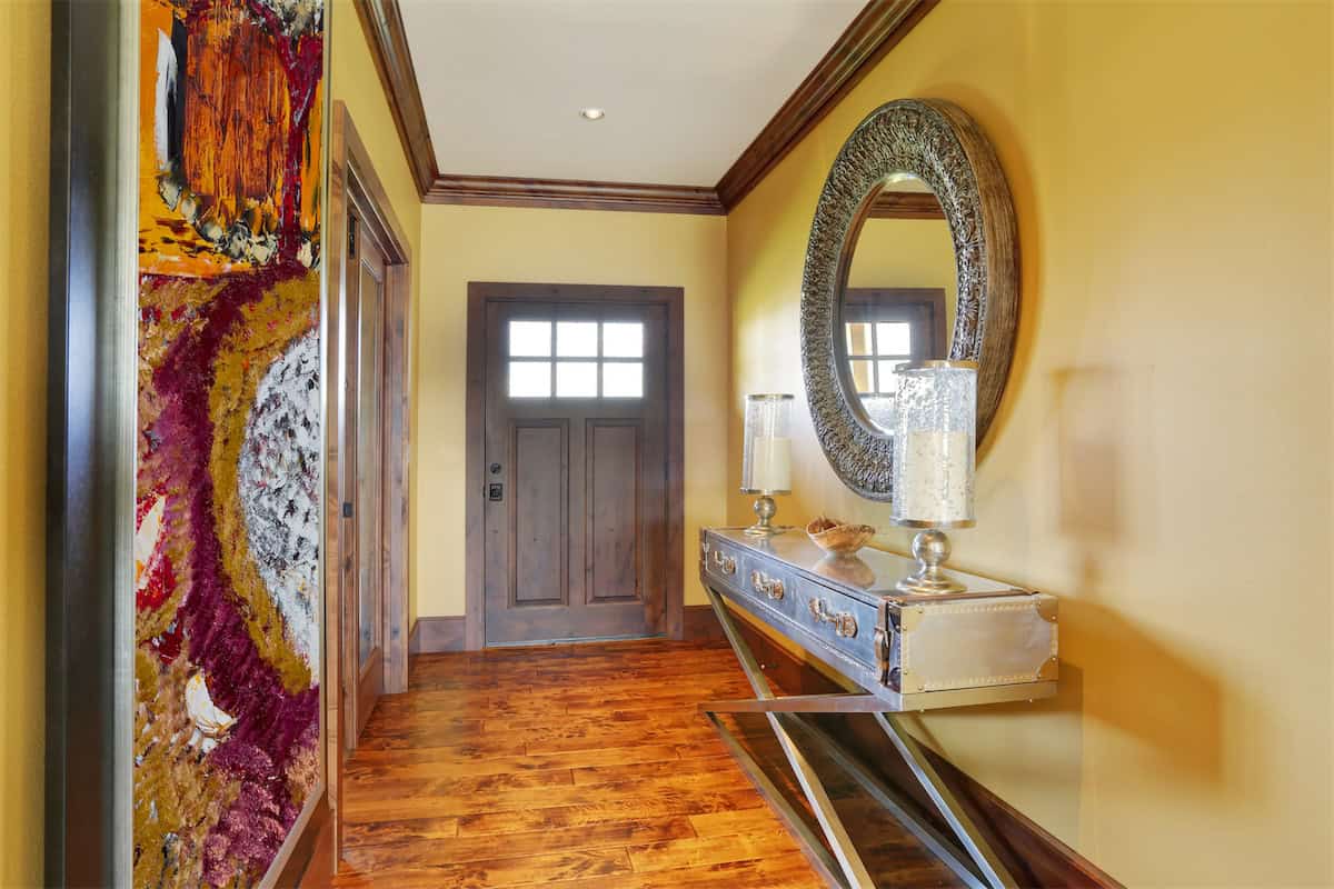 Ornate Entryway Mirror Above a Vintage Console