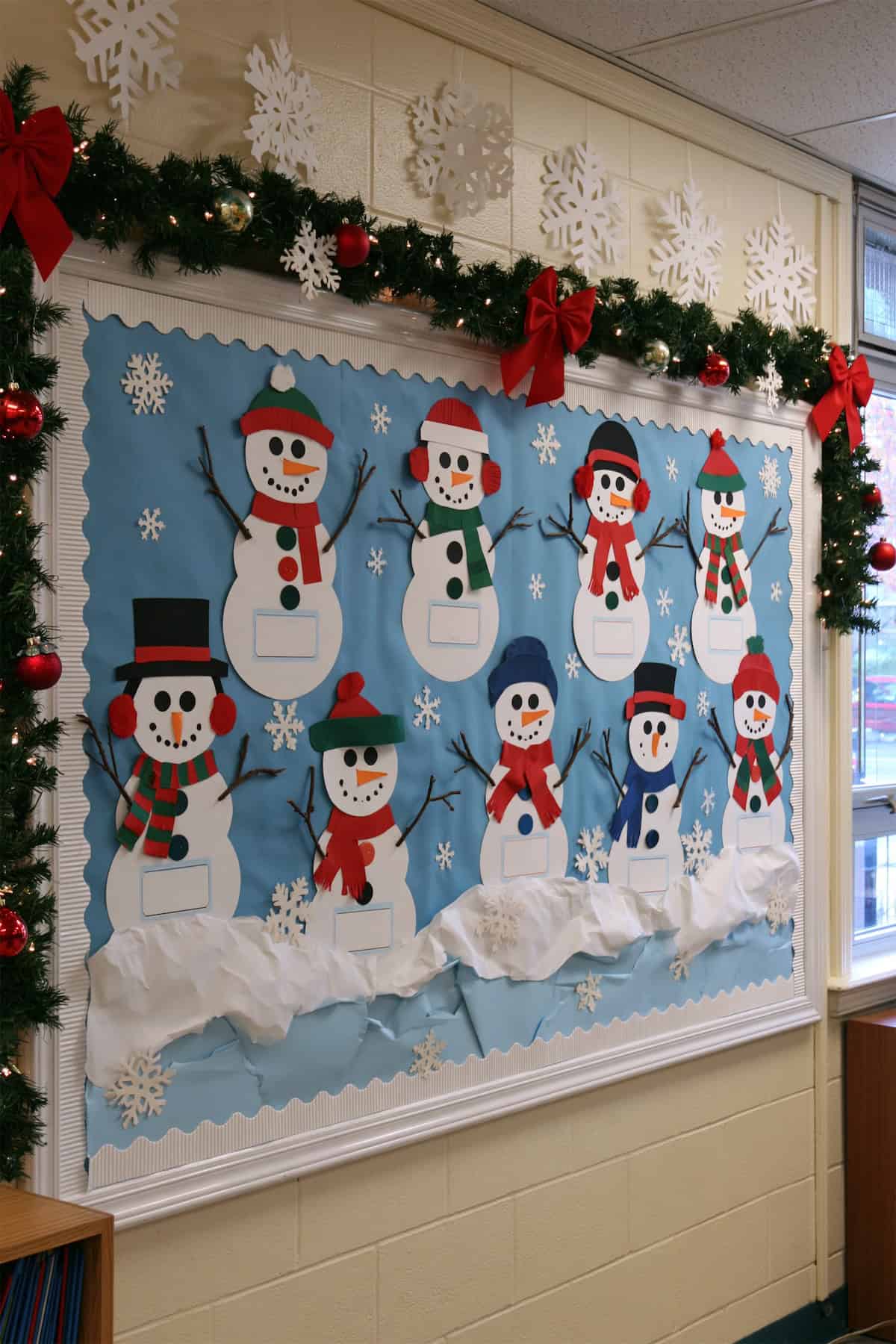 Christmas Snowmen Above Paper Snowdrifts